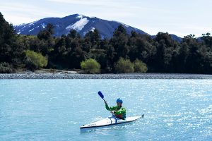 Person kayaking in New Zealand. 