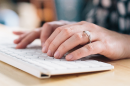 woman typing on keyboard