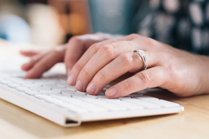 woman typing on keyboard