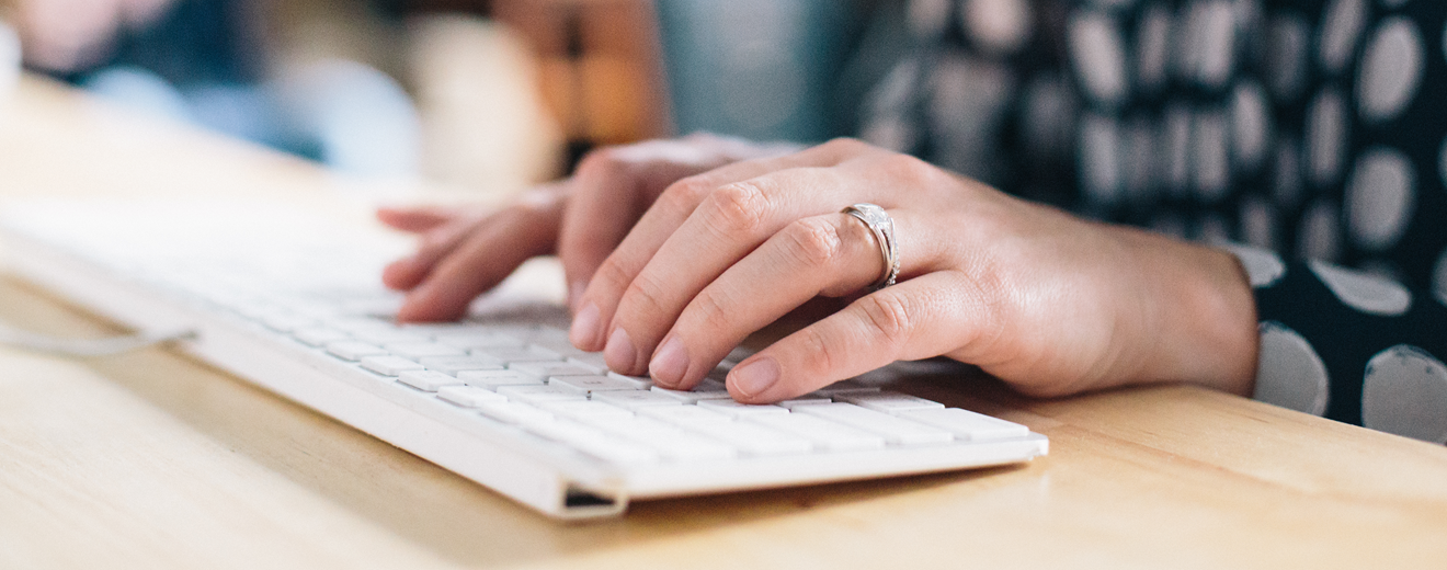 woman typing on keyboard